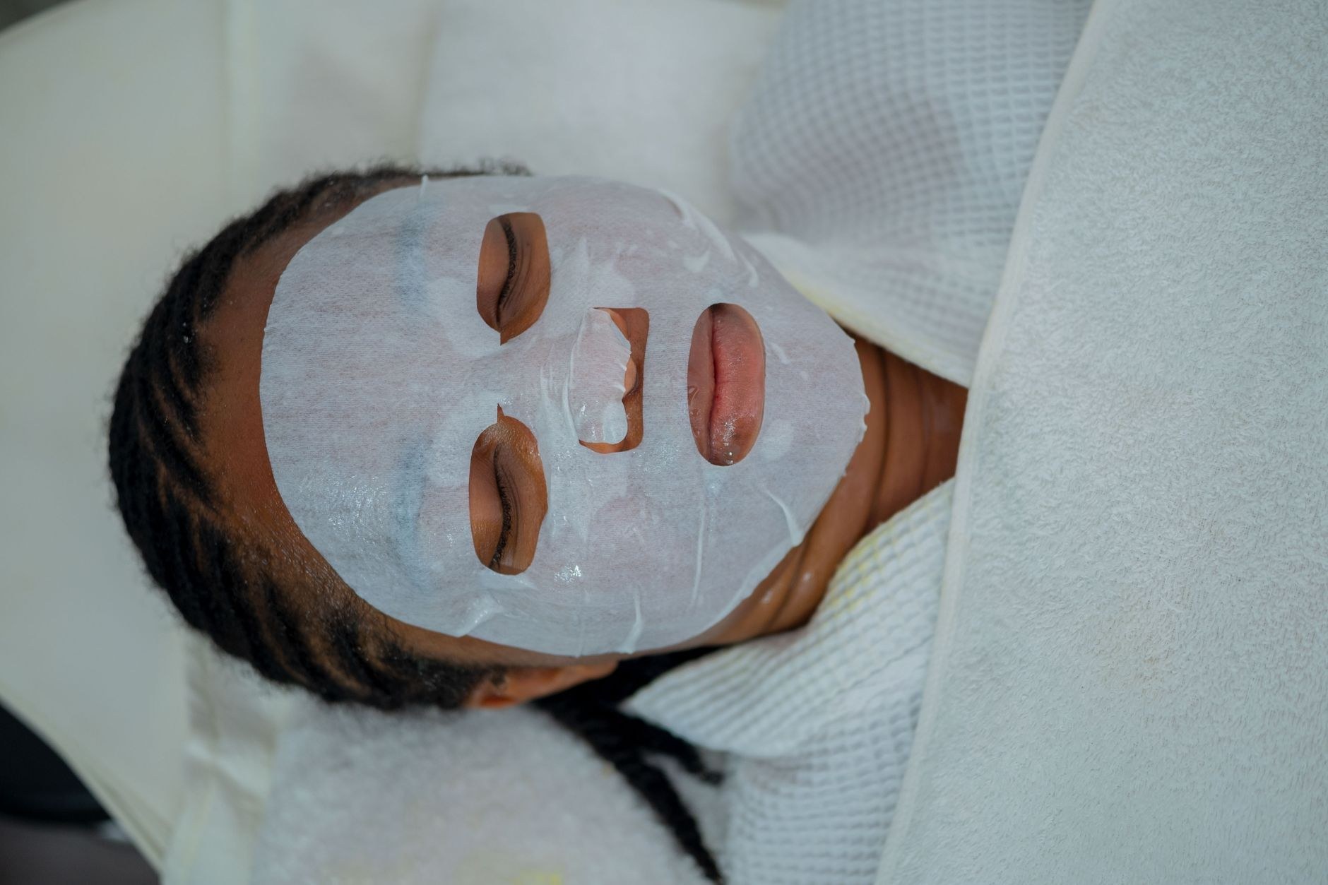 Client relaxing during a facial (sample image)